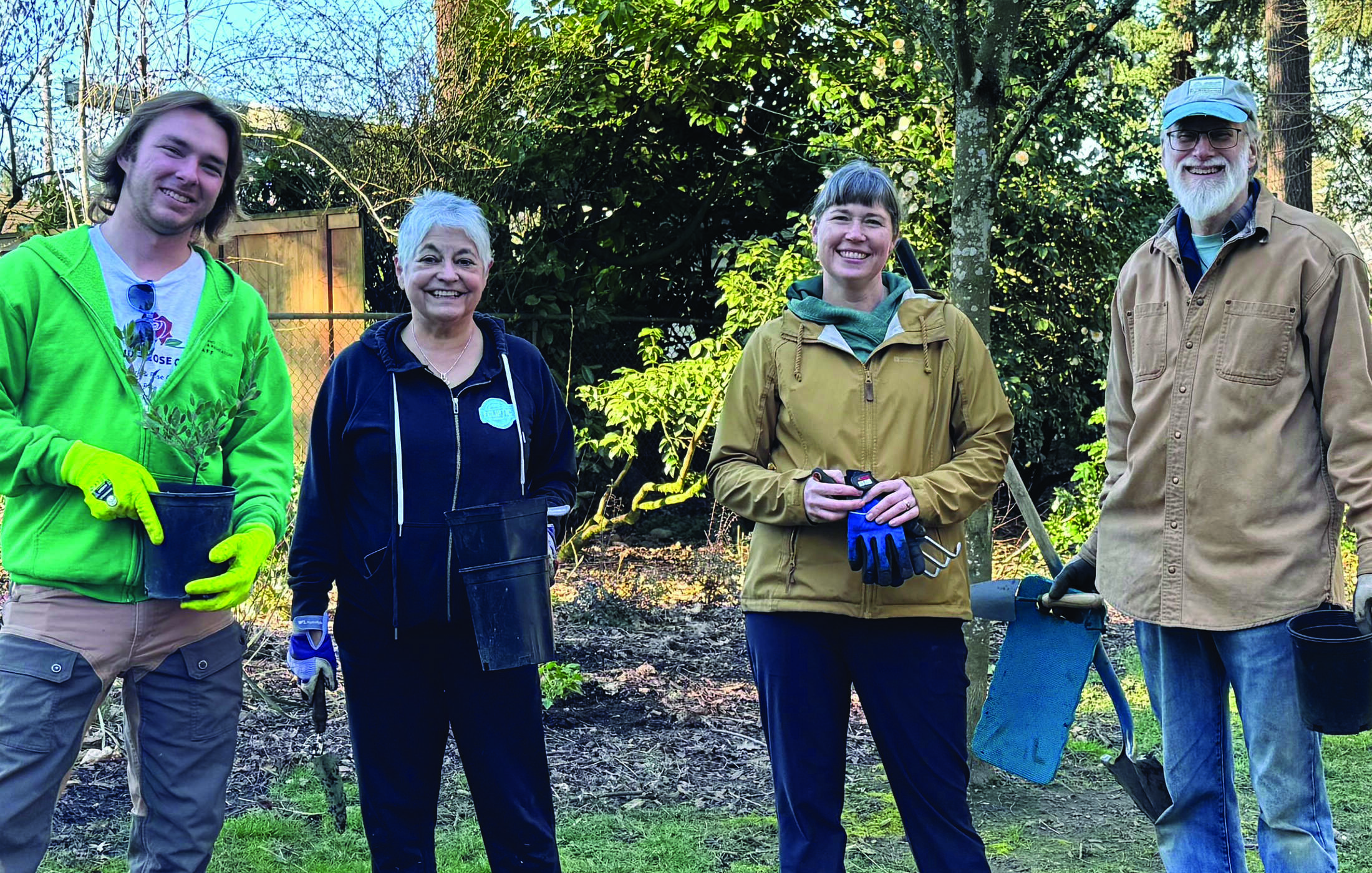 Volunteers with buckets and shovels at a Wilshire Park planting