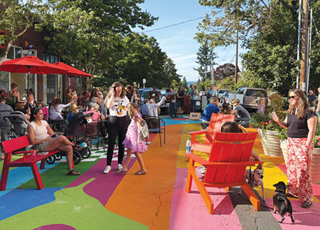 Concordia Neighborhood Association worked with PBOT to establish the plaza at NE 30th and Killingsworth. Concordia Commons is a popular gathering space. Photo by Susan Trabucco.