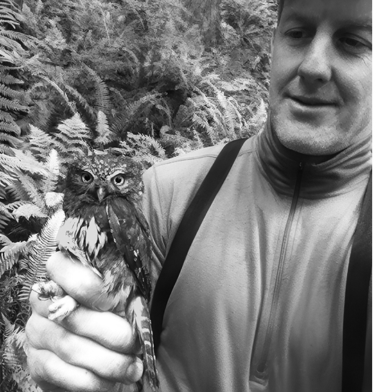 John Deshler frequents Wilshire Park to observe Cooper's hawk activity there. Here he is shown with a character from his book, "The Pygmy-Owls of Forest Park." Photo by John Deshler.