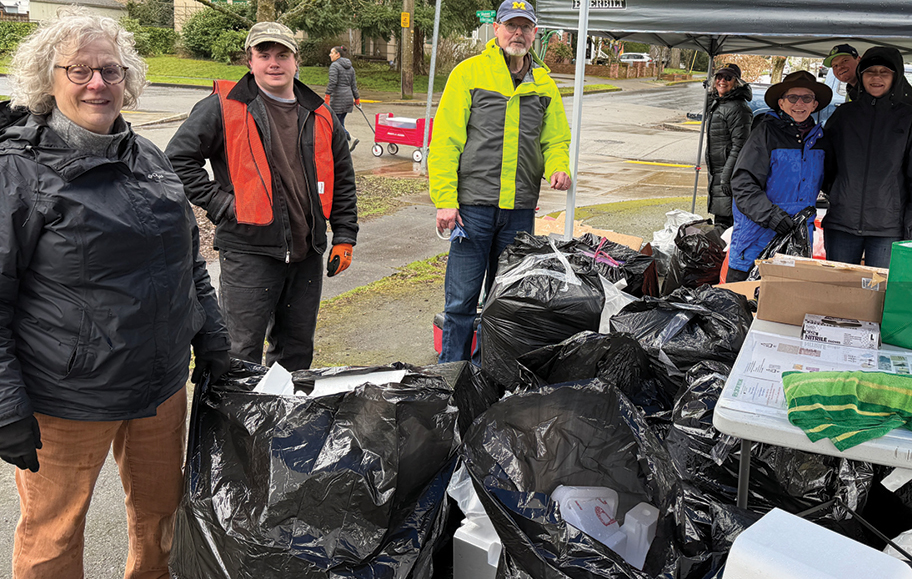 Posing among myriad 45-gallon bags of Styrofoam they had crunched, stomped, or hacked for bagging, this bevy of intrepid B-W volunteers withstood the winter elements to help at BWNA's February recycling event. Photo by Susan Trabucco.