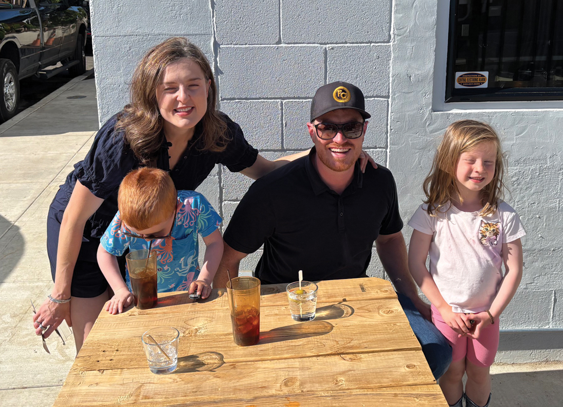 Fremont Garage developer Daniel Silvey with his wife Kalli and their kids on opening day