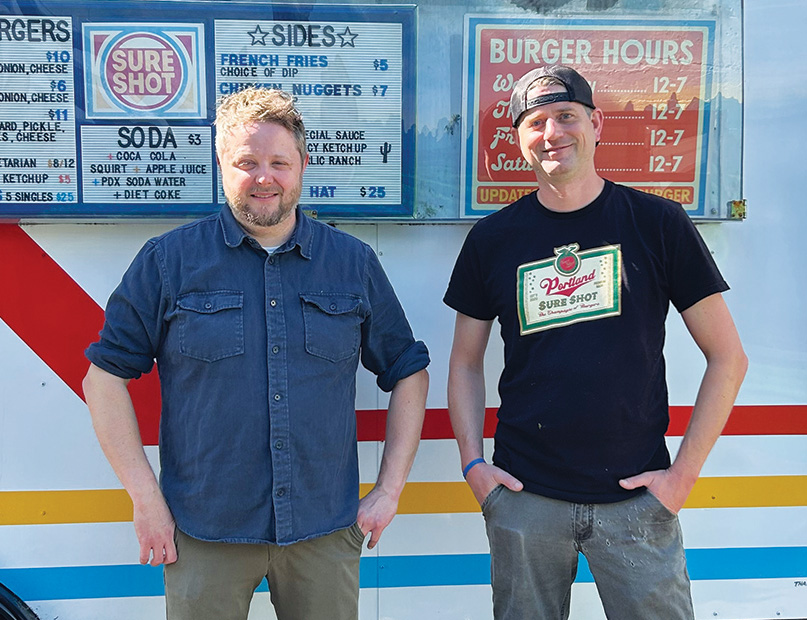 Sure Shot Burger co-owners Nick Jarvis (left) and Will Kuhns are launching a brick-and-mortar version of their smash burger cart – just next door. Photo by Chris Rauber.