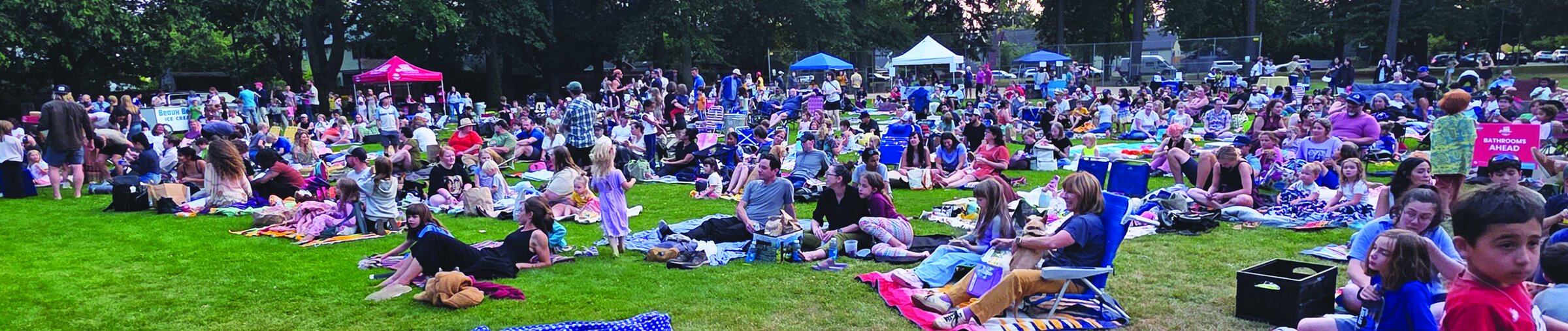 A wide view of the crowd gathered on the lawn at Wilshire Park for the movie.